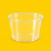 Clear PET round deli container 355ml, three-quarter view on yellow