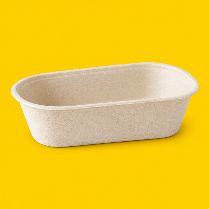 Natural bagasse oval shallow salad bowl 650ml, three-quarter view on yellow