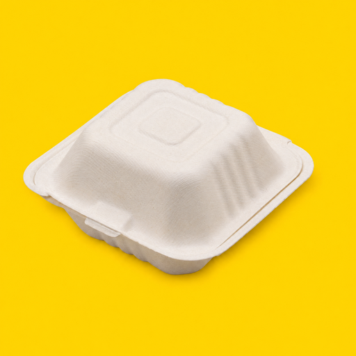 Bagasse 6 inch burger box, closed, on yellow