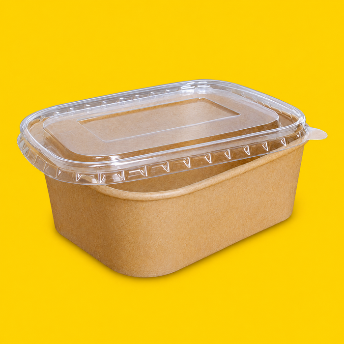 Clear PET lid fitted on a rectangular kraft salad bowl, on yellow