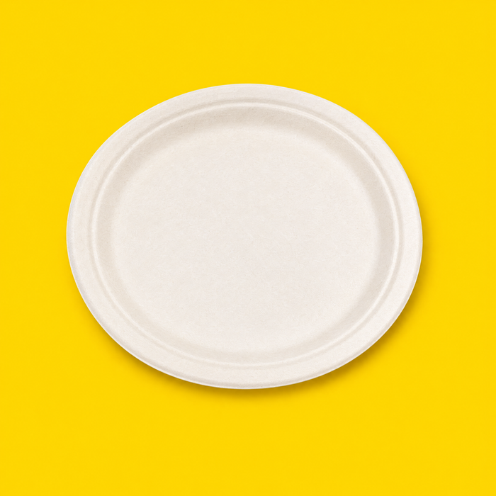 White bagasse 9 inch round plate, on yellow
