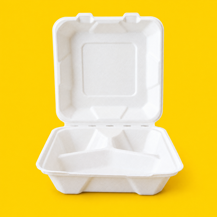 White bagasse 8x8 inch three-compartment clamshell, open, on yellow
