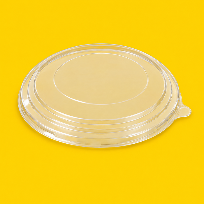 Clear PET lid for round kraft salad bowl, on yellow