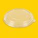 Clear PET lid for round kraft salad bowl, on yellow