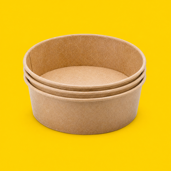Stack of brown kraft round salad bowls 500ml, on yellow