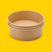 Stack of brown kraft round salad bowls 500ml, on yellow