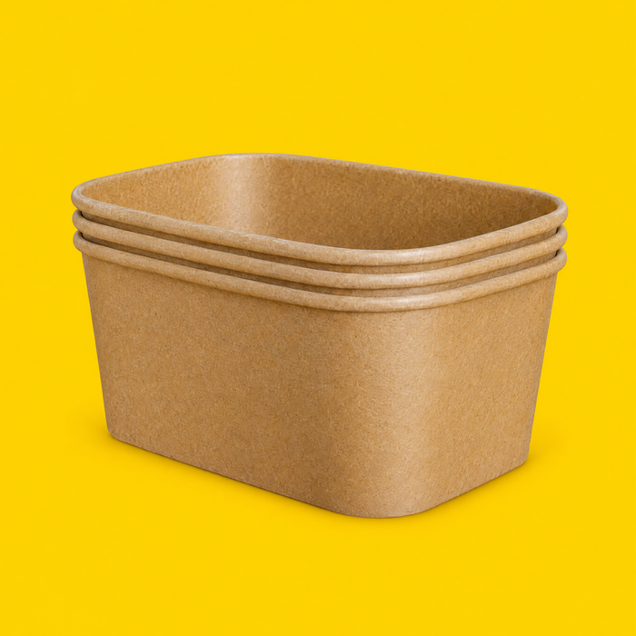 Stack of brown kraft rectangular salad bowls 1000ml, on yellow