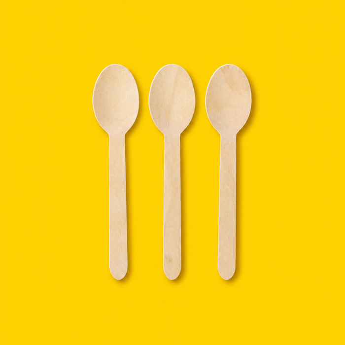 Three birchwood wooden spoons 165mm, on yellow
