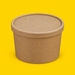 Kraft paper lid fitted on an 8oz soup container, on yellow