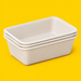 Stack of natural bagasse rectangular trays 800ml, on yellow