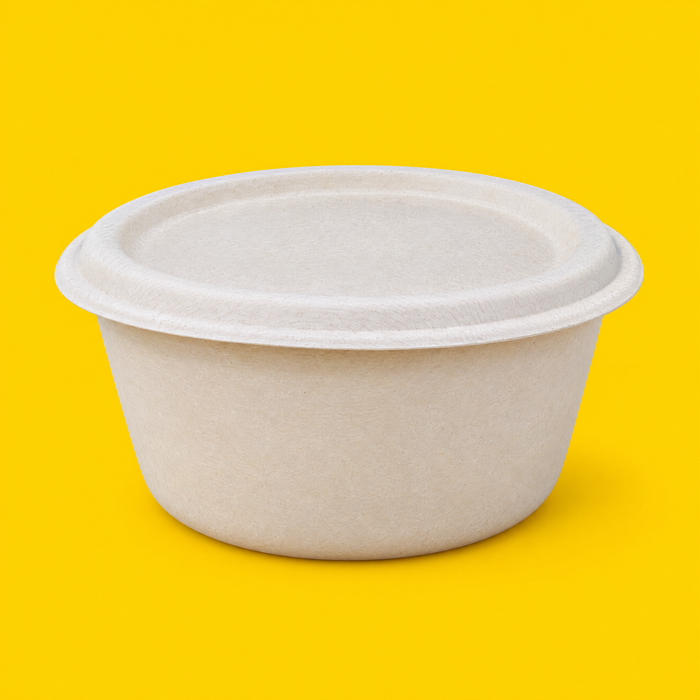 Natural bagasse lid fitted on a 1500ml round bowl, on yellow