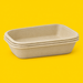 Stack of natural bagasse rectangular trays 750ml, on yellow