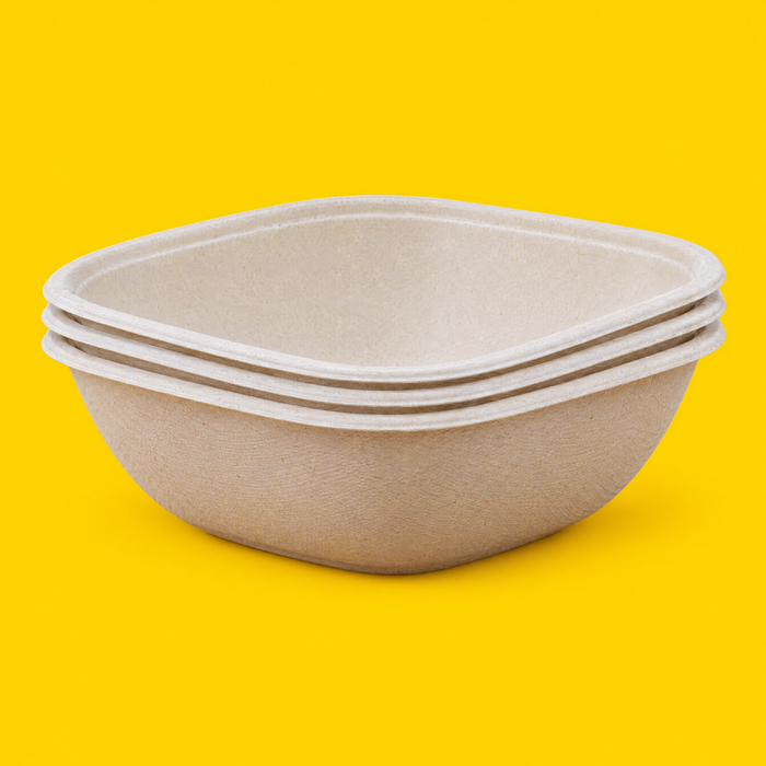 Stack of natural bagasse square bowls 1500ml, on yellow
