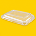 Clear PET lid for bagasse rectangular trays, on yellow