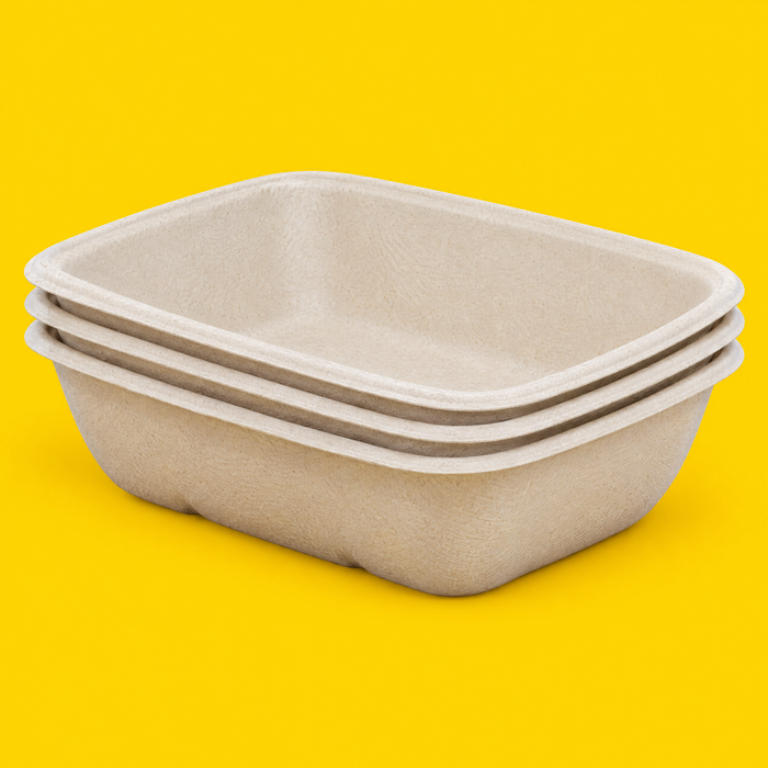 Stack of natural bagasse rectangular trays 1000ml, on yellow