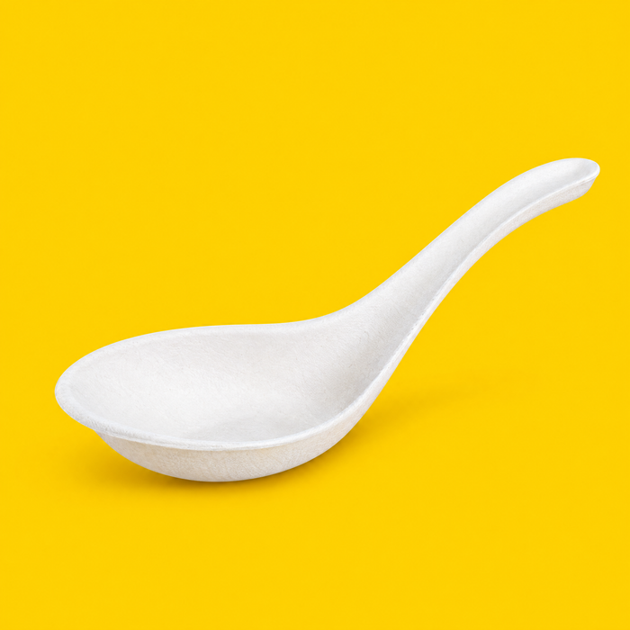 Close-up of a white bagasse Chinese soup spoon 140mm, on yellow