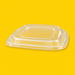 Clear PET lid for bagasse square bowl, on yellow