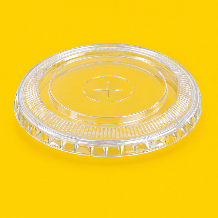 Clear PET flat lid 98mm, on yellow