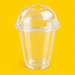 Clear rPET dome lid fitted on a 12oz smoothie cup, on yellow