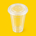 Clear PET flat lid fitted on a 12oz cold cup, on yellow