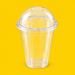 Clear PLA dome lid fitted on a 16oz PLA cold cup, on yellow
