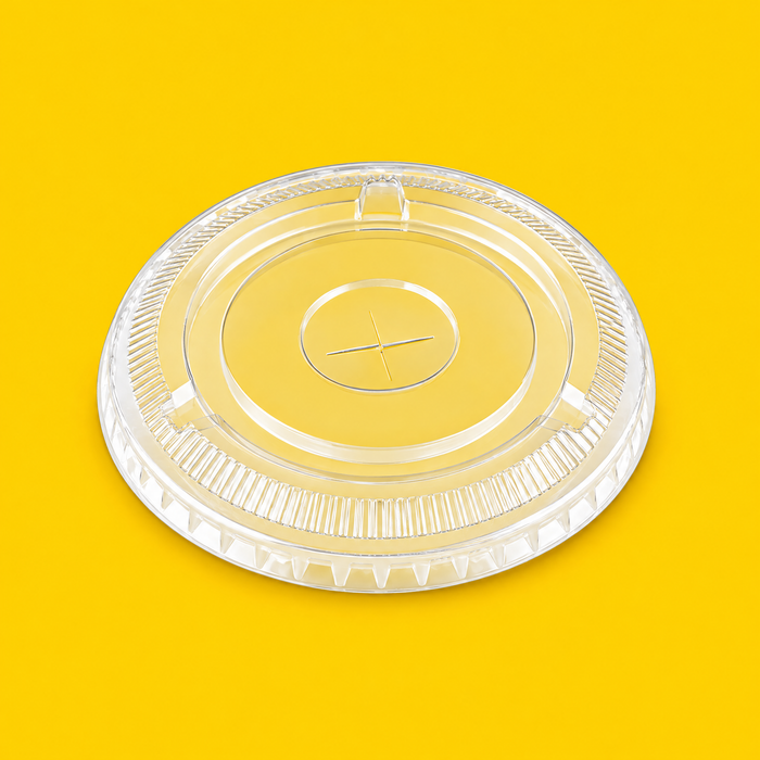 Clear rPET flat lid for smoothie cup, on yellow