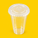 Clear PLA flat lid fitted on a 16oz PLA cold cup, on yellow