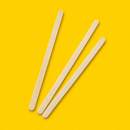 Close-up of birchwood coffee stirrers 140mm, on yellow