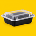 Black rectangular food container with clear lid 1000ml, on yellow
