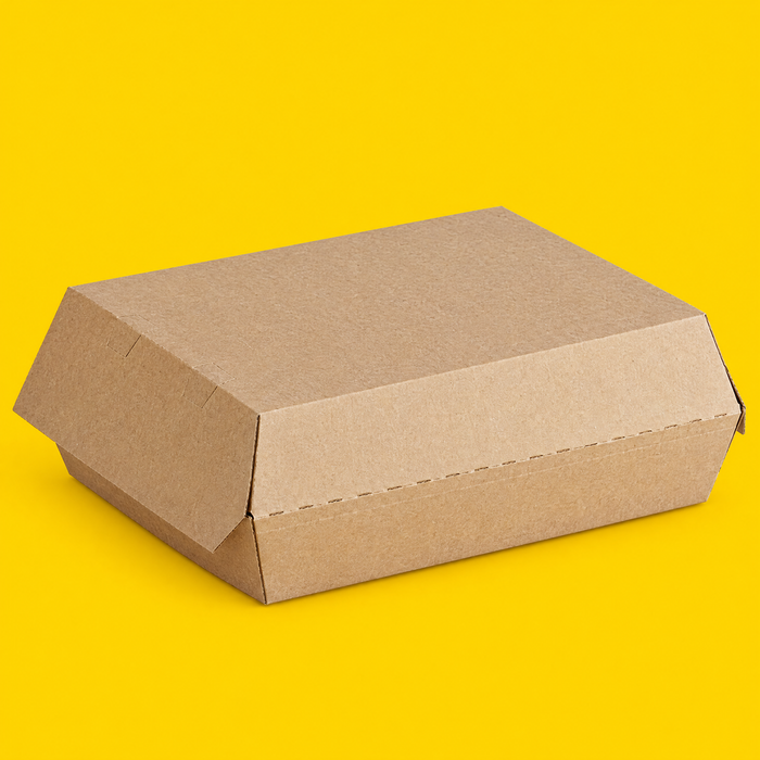 Hinged corrugated kraft box, closed, on yellow