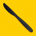 Close-up of a black cornstarch knife, on yellow