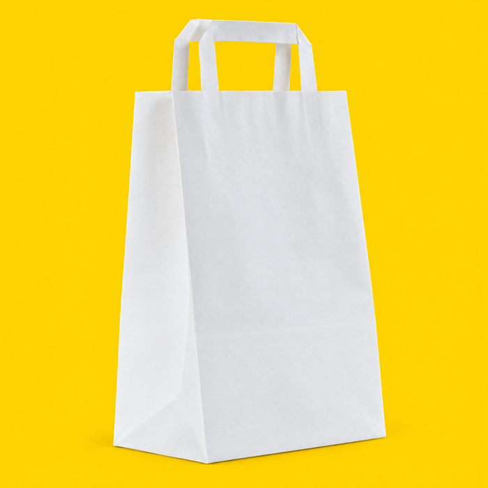 Medium white paper carrier bag with handles, on yellow