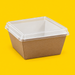Small Fuzione clear lid fitted on a kraft tray, on yellow