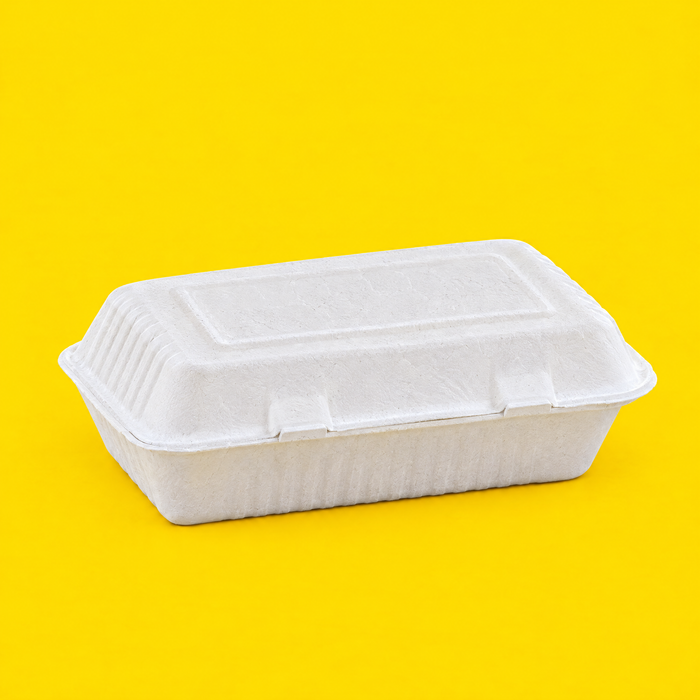 White bagasse 9x6 inch clamshell, closed, on yellow